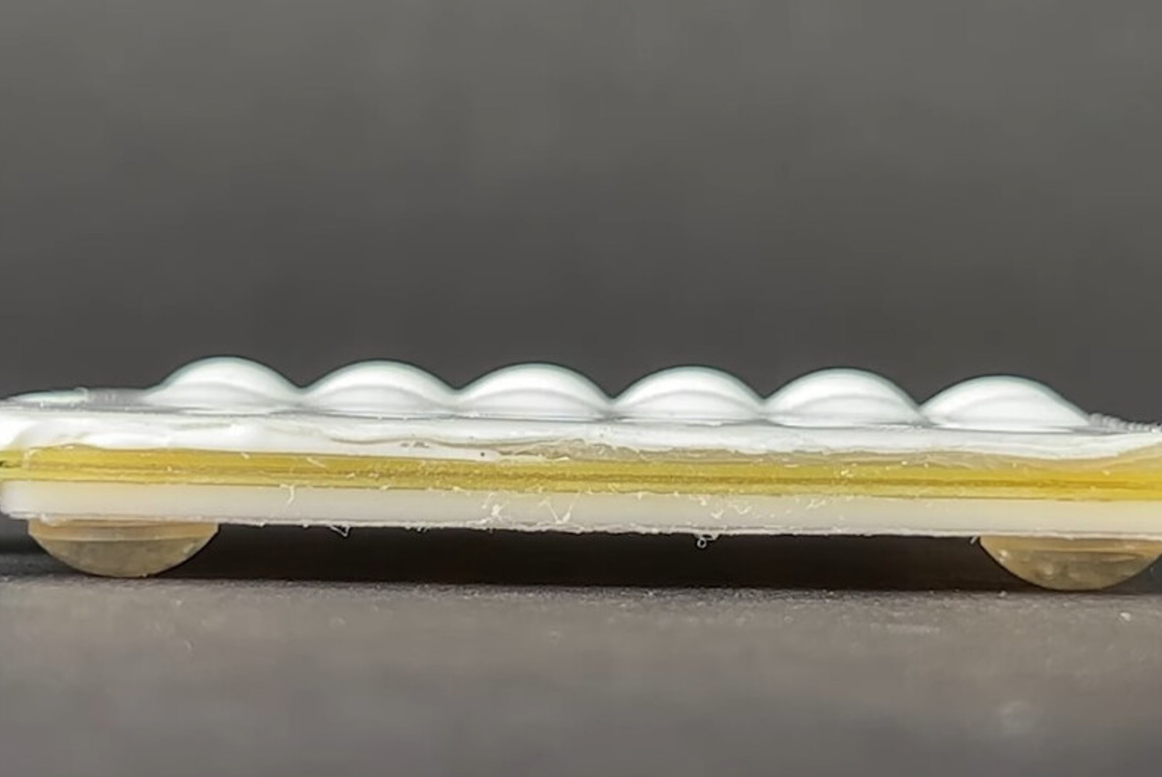 New tactile technology may allow for a pop-up keyboard on a flat smartphone display