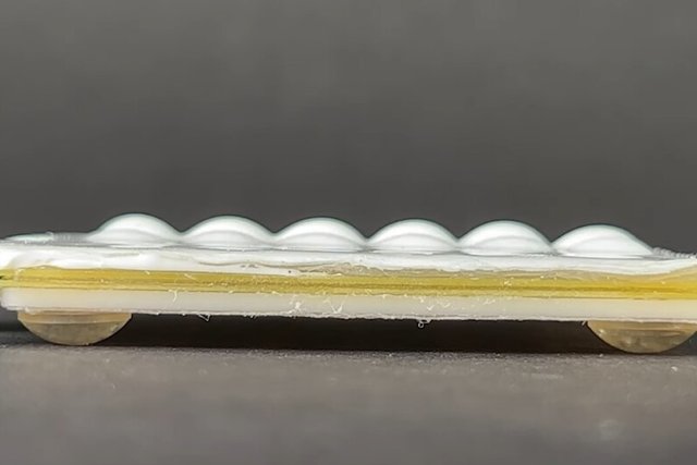 New tactile technology may allow for a pop-up keyboard on a flat smartphone display