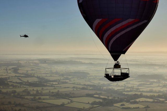 Red Bull athlete Kriss Kyle breaks boundaries by riding BMX 2000 Feet in the air under a hot air balloon